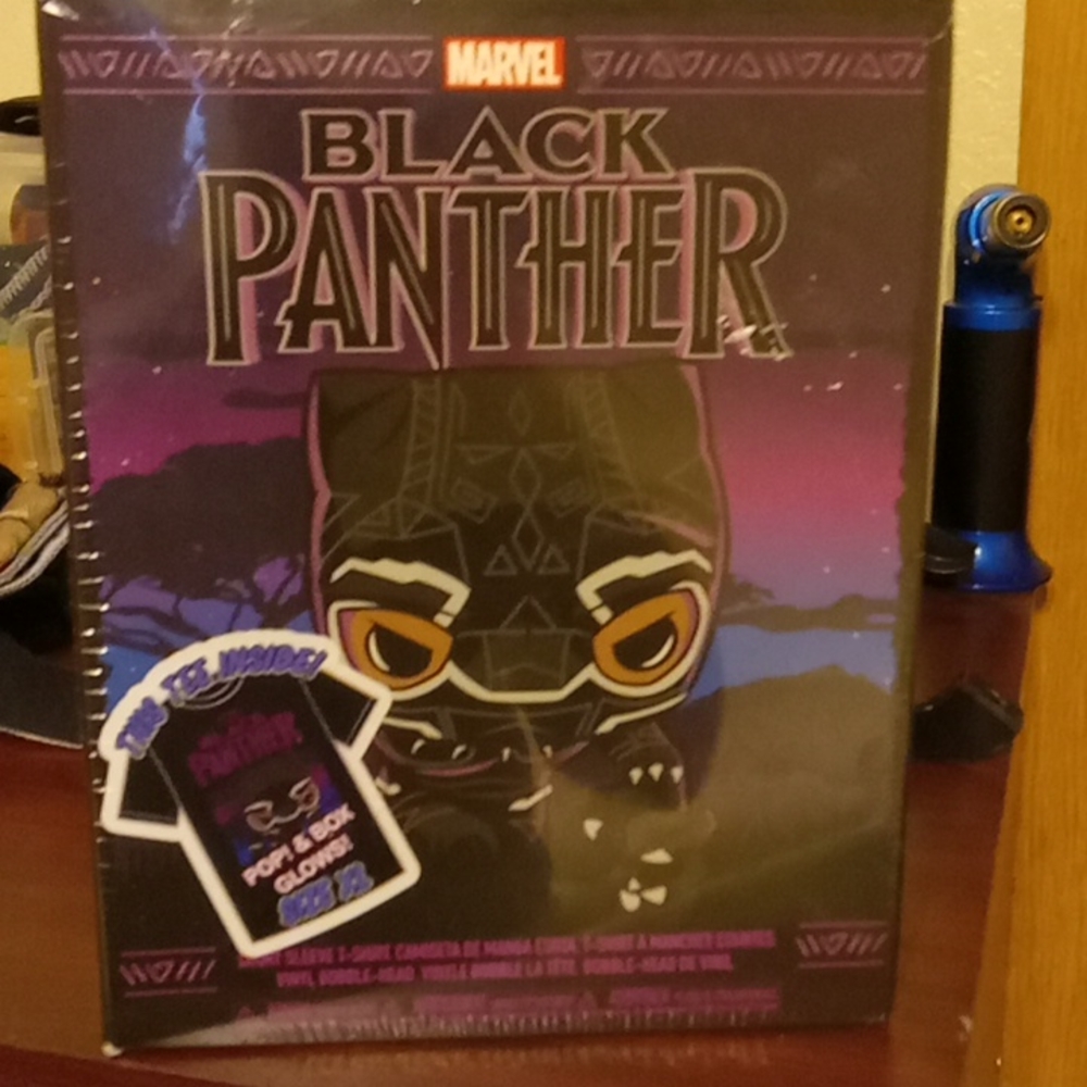 Brand new still in plastic covered box Tshirt and funko Black Panther
